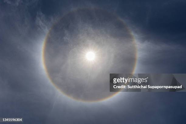 the sun halo with blue sky. - halo symbol stock pictures, royalty-free photos & images