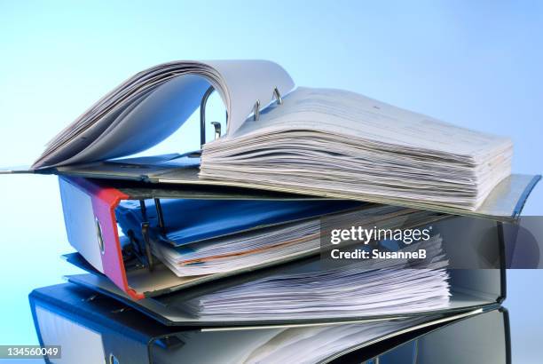 pile of ring binders with open binder on top - case file stock pictures, royalty-free photos & images