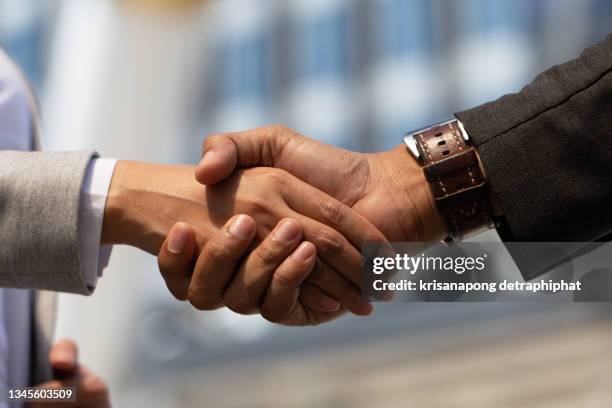 business people shaking hands - shaking stock pictures, royalty-free photos & images