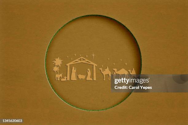 christmas nativity in paper work and brown background with copyspace - nativity stable stock pictures, royalty-free photos & images