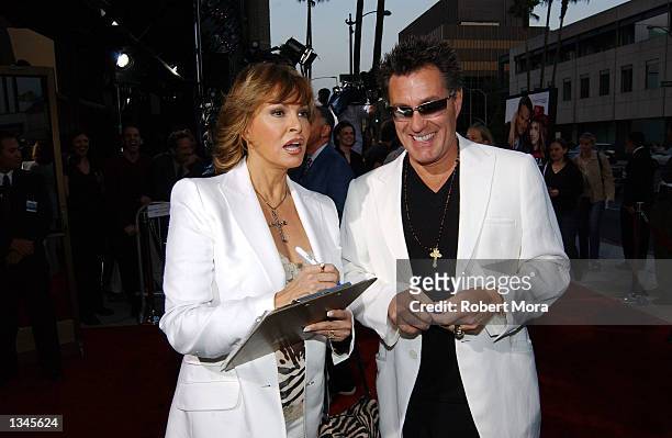 Actress Raquel Welch and husband, Richard Palmer, sign autographs prior to the premiere of "Serving Sara" at the Samuel Goldwyn Theater on August 20,...