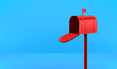 Opened red mail box on blue background