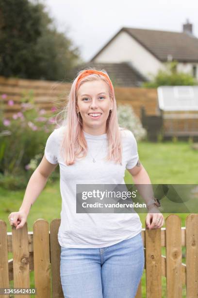 pink-haired lady wearing an orange headband - long blonde hair stock pictures, royalty-free photos & images