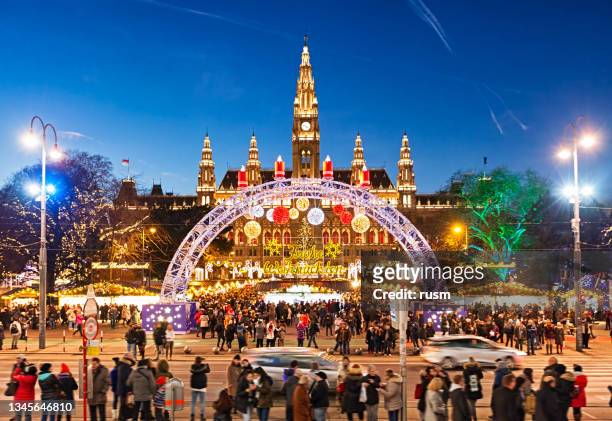 christmas market on rathausplatz in vienna at christmas eve - austria stock pictures, royalty-free photos & images