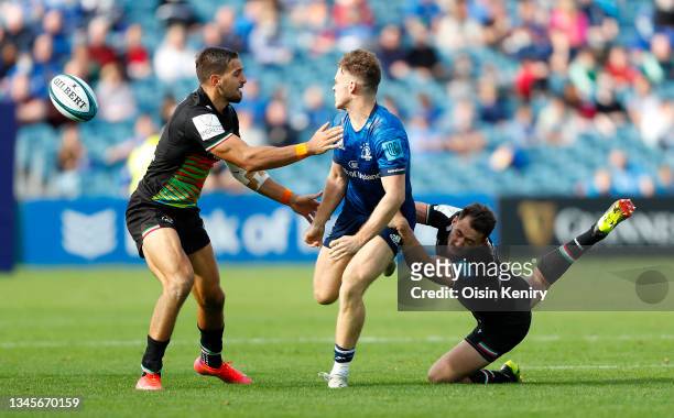 Rob Russell of Leinster is tackled by Erich Cronje of Zebre at RDS Arena on October 09, 2021 in Dublin, Ireland.