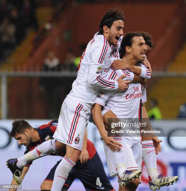 Zlatan Ibrahimovic of AC Milan celebrates with his team-mates after scoring during the Serie A match between Genoa CFC and AC Milan at Stadio Luigi...