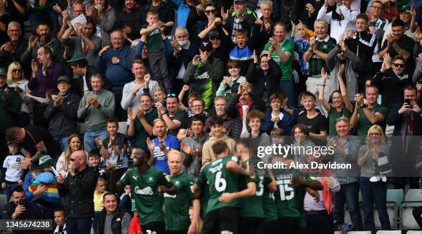 Plymouth fans celebrate after Conor Grant of Plymouth scores the opening goal during the Sky Bet League One match between Plymouth Argyle and Burton...