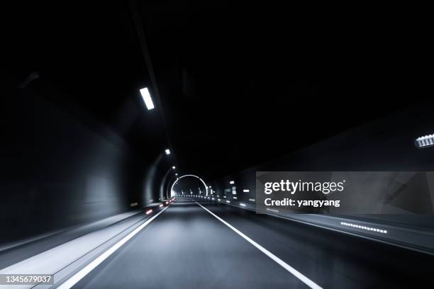 modern highway tunnel underpass - light at the end of the tunnel stock pictures, royalty-free photos & images