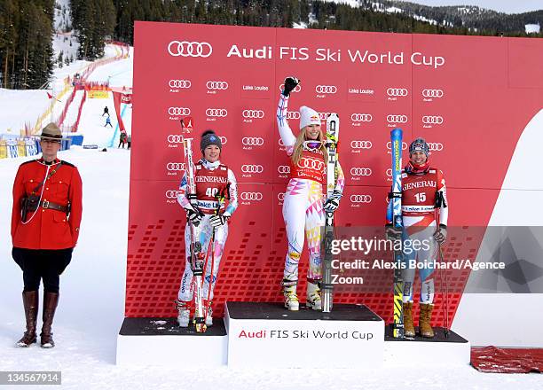 Lindsey Vonn of the USA takes 1st place, Tina Weirather of Liechtenstein takes 2nd place and Dominique Gisin of Switzerland takes 3rd place during...