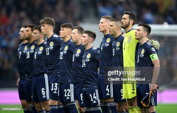 Andy Robertson of Scotland leads the team as they line up to sing the national anthem during the 2022 FIFA World Cup Qualifier match between Scotland...