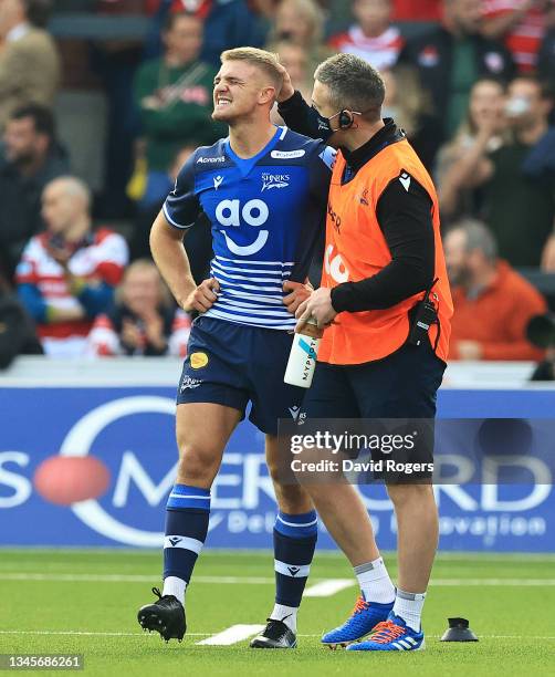 Tom Curtis of Sale Sharks is consoled after missing a last minute conversion during the Gallagher Premiership Rugby match between Gloucester Rugby...