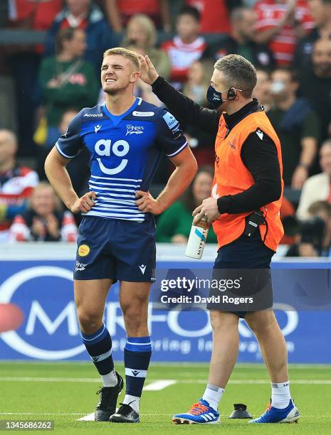 Tom Curtis of Sale Sharks is consoled after missing a last minute conversion during the Gallagher Premiership Rugby match between Gloucester Rugby...