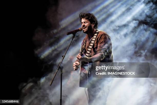 man singing and playing the guitar in front of the microphone - singer ストックフォトと画像