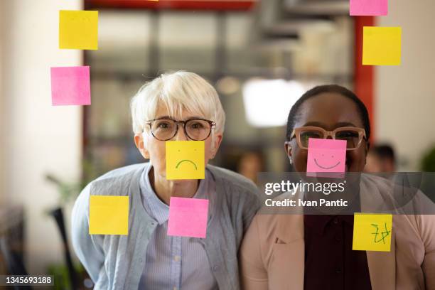 portrait of a diverse group of coworkers in their office, enjoying their work - diversão imagens e fotografias de stock