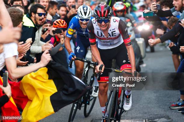 Fausto Masnada of Italy and Team Deceuninck - Quick-Step and Tadej Pogacar of Slovenia and UAE Team Emirates compete in the breakaway while fans...