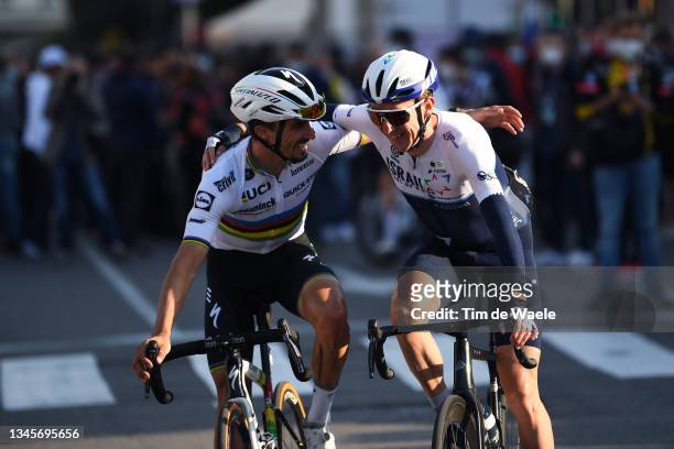 Julian Alaphilippe of France and Team Deceuninck - Quick-Step hugs to Daniel Martin of Ireland and Team Israel Start-Up Nation at finish line during...