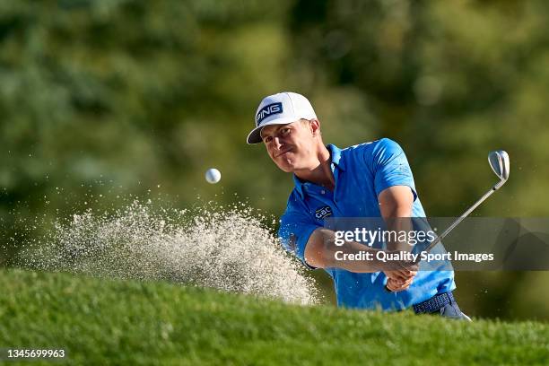 Calum Hill of Scotland plays a shot from a bunker during Day Three of The Open de Espana at Club de Campo Villa de Madrid on October 09, 2021 in...