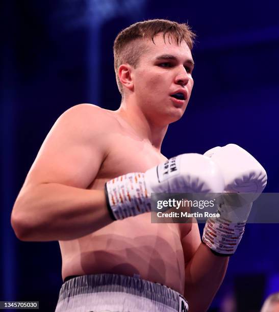 Viktor Jurk of Germany in action against Zoltan Csala of Hungary during their Heavyweight fight at GETEC-Arena on October 09, 2021 in Magdeburg,...