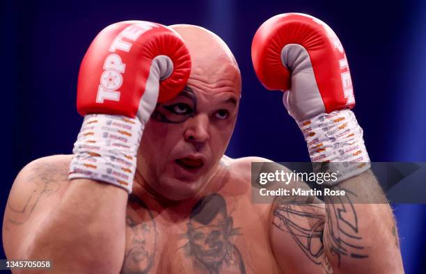 Zoltan Csala of Hungary in action against Viktor Jurk of Germany during their Heavyweight fight at GETEC-Arena on October 09, 2021 in Magdeburg,...