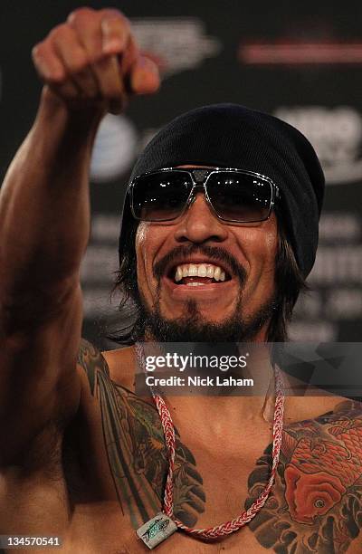 Antonio Margarito of Mexico gestures as he takes the scale for his bout with Miguel Cotto of Puerto Rico during their weigh in at The Theater at...