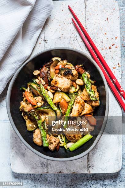 bowl of chinese kung pao chicken - kung-pao stock pictures, royalty-free photos & images
