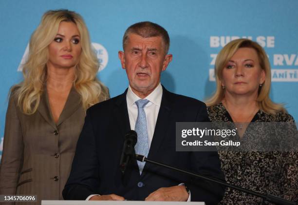 Czech Prime Minister Andrej Babis speaks to the media as his wife Monika looks on after his ANO political movement lost parliamentary elections on...