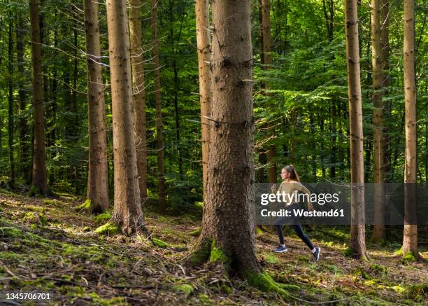 Runner In Woods 3,189 Female Runner Woods Stock Photos, High-Res Pictures, and Images ...