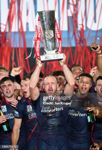 James Roby of St Helens lifts the trophy following their team's victory in the Betfred Super League Grand Final match between Catalans Dragons and St...