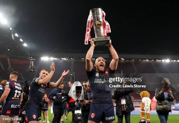 James Roby of St Helens lifts the Grand Final Trophy and celebrates with the fans after victory in the Betfred Super League Grand Final match between...