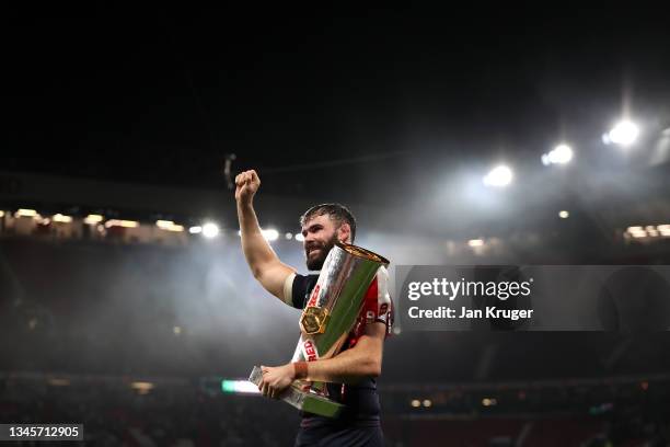 Alex Walmsley of St Helens celebrates with the trophy following their team's victory in the Betfred Super League Grand Final match between Catalans...