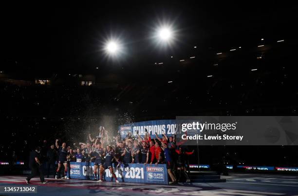 James Roby of St Helens lifts the Grand Final Trophy and celebrates victory with the team during the Betfred Super League Grand Final match between...