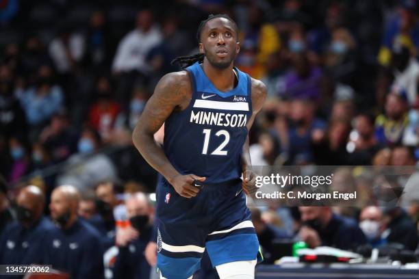 Taurean Prince of the Minnesota Timberwolves looks on against the Denver Nuggets during the fourth quarter at Ball Arena on October 8, 2021 in...