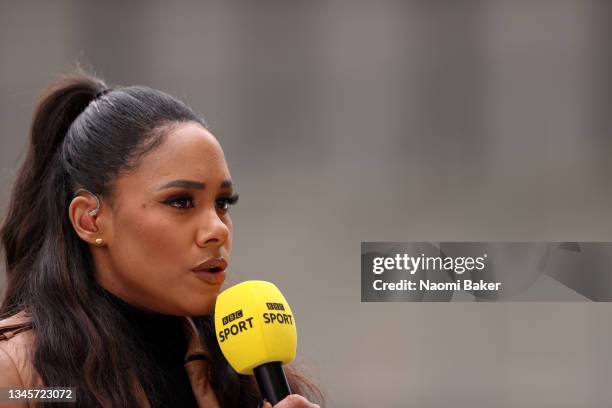 Presenter and former football player Alex Scott speaks prior to during the Barclays FA Women's Super League match between Manchester United Women and...