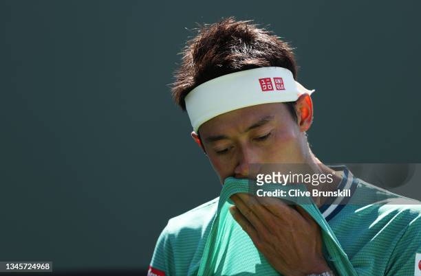 Kei Nishikori of Japan shows his dejection against Dan Evans of Great Britain during their second round match on Day 6 of the BNP Paribas Open at the...