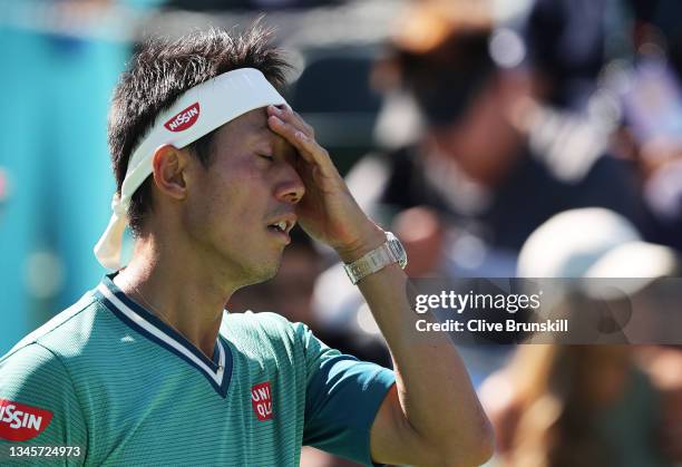 Kei Nishikori of Japan shows his dejection against Dan Evans of Great Britain during their second round match on Day 6 of the BNP Paribas Open at the...