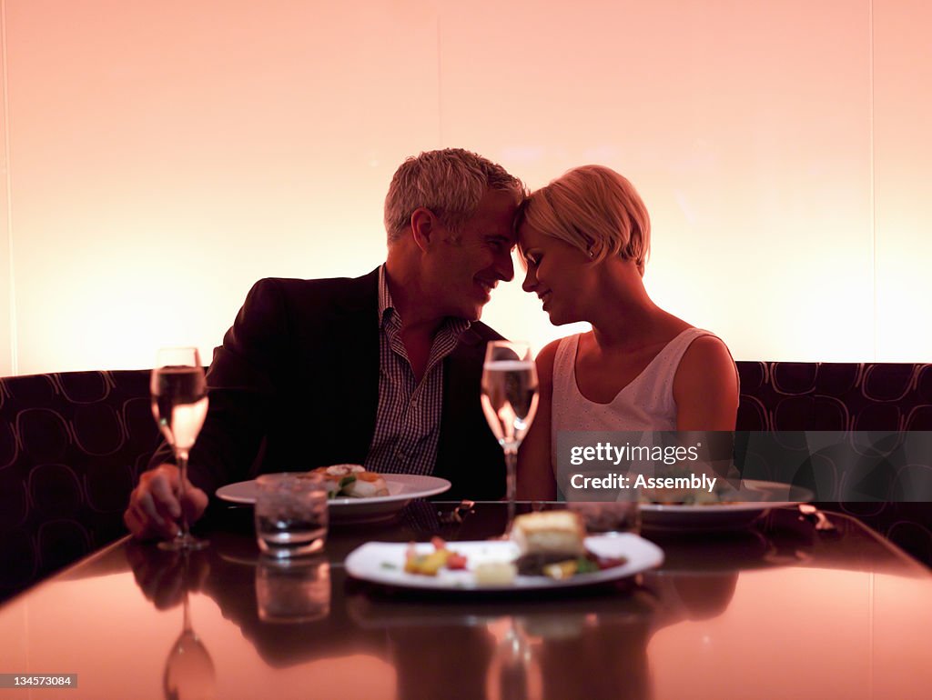 Couple enjoying a romantic meal.