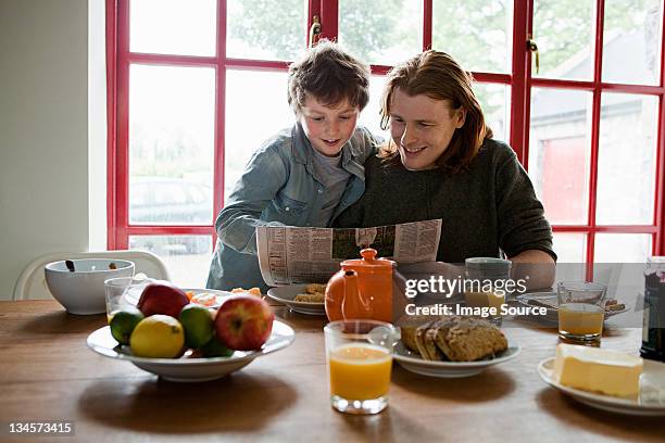 father and son having breakfast - irish family stock pictures, royalty-free photos & images