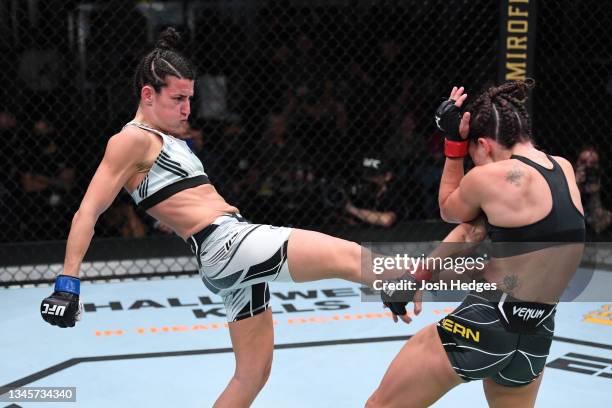 Marina Rodriguez of Brazil kicks Mackenzie Dern in their women's strawweight bout during the UFC Fight Night event at UFC APEX on October 09, 2021 in...