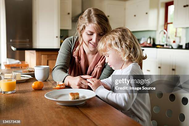 mother and daughter having breakfast - irish family stock pictures, royalty-free photos & images