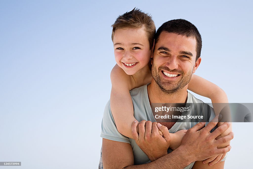 Father and son embracing