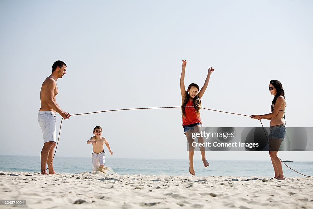 Family holding running competition on a beach