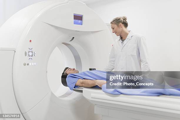 doctor preparing patient for ct scanner - cat scan 個照片及圖片檔