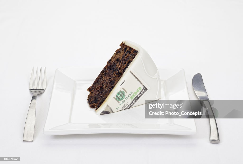 Dollar bill printed on slice of cake