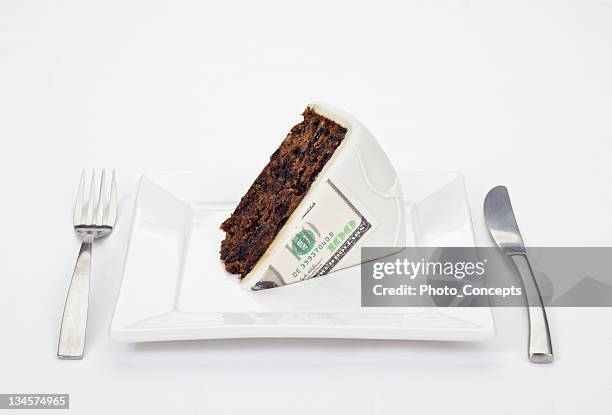 dollar bill printed on slice of cake - slice cake stock pictures, royalty-free photos & images
