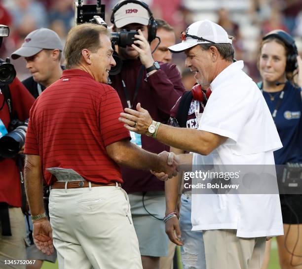 Head coach Nick Saban of the Alabama Crimson Tide and head coach Jimbo Fisher of the Texas A&M Aggies meet before the game at Kyle Field on October...