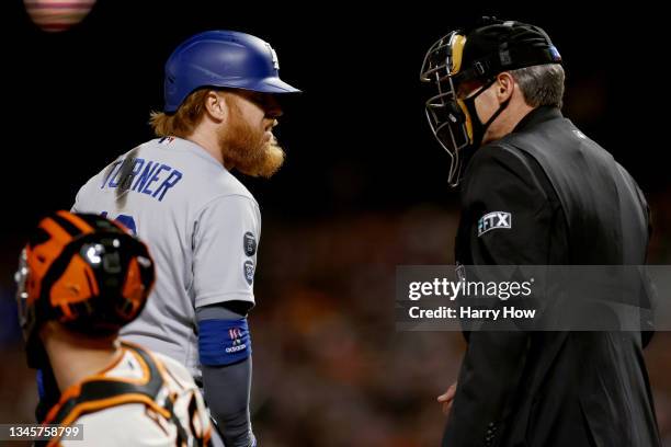 Justin Turner of the Los Angeles Dodgers argues a call with umpire Angel Hernandez after striking out in the sixth inning against the San Francisco...