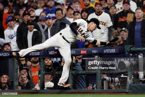 Wilmer Flores of the San Francisco Giants attempts to catch a foul ball in the sixth inning against the Los Angeles Dodgers during Game 2 of the...