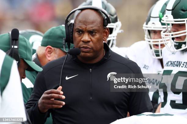 Head coach Mel Tucker of the Michigan State Spartans talks to his team during a game against the Rutgers Scarlet Knights at SHI Stadium on October 9,...