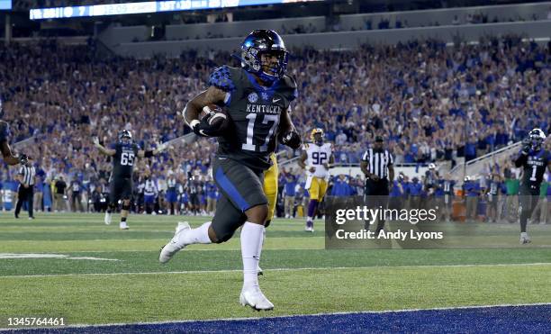 Ju Tahn McClain of the Kentucky Wildcats scores a touchdown against the LSU Tigers at Kroger Field on October 09, 2021 in Lexington, Kentucky.