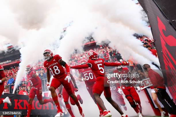 Rutgers Scarlet Knights players run onto the field before a game against the Michigan State Spartans at SHI Stadium on October 9, 2021 in Piscataway,...